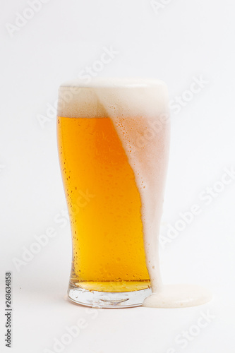 lager draft beer in a glass on white background	