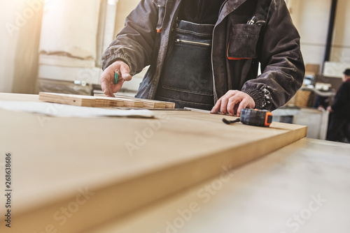 Cropped image of a craftsman working at his workstation