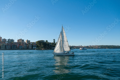 Sail boat on blue background. Travel background