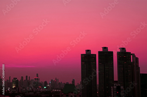 Silhouette of skyscrapers Against Evening Sky in Vibrant Pink Gradation  © jobi_pro