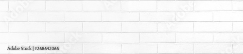 White brick wall texture or pale soft color brick wall as background.