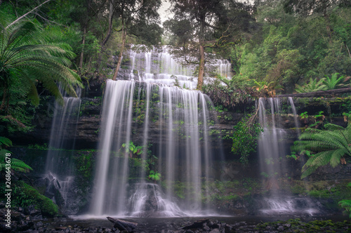 Picturesque waterfall in the forest nature background