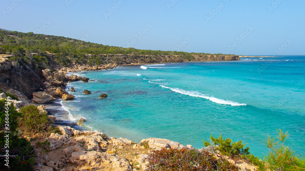 Cyprus coastline. Sea rocky beach in Cyprus on sunny clear day. Sea shore landscape with turquoise water