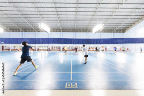 Blurred image of Badminton Court,People playing sports.