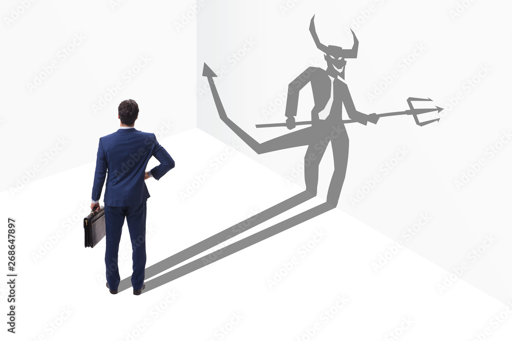 Fototapeta premium Devil hiding in the businessman - alter ego concept