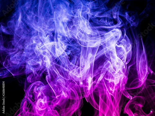 Colored smoke on black background