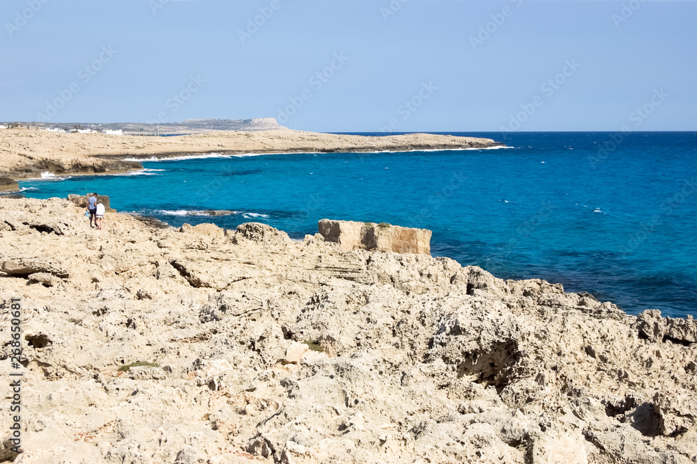 Beautiful seascape with blue sea and rocky shore in Cyprus.
