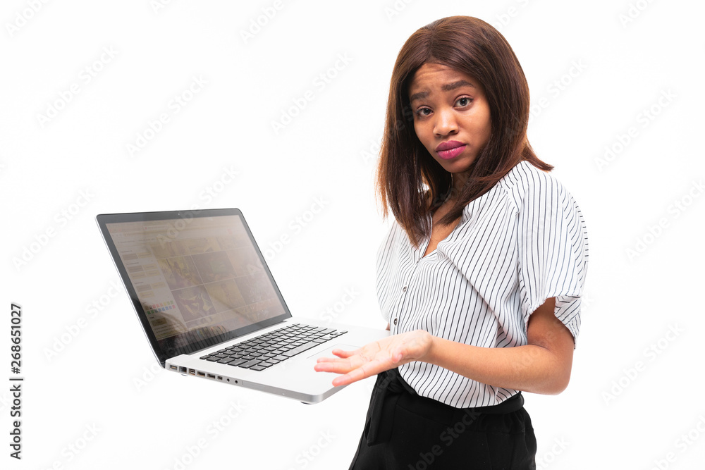 smilling dark-skinned young girl present smth on the laptop isolated on background smilling dark-skinned young girl present smth on the laptop isolated on background