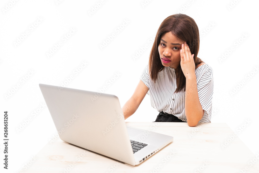 dark-skinned young girl typing on the laptop isolated on background dark-skinned young girl typing on the laptop isolated on background