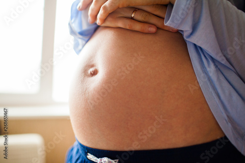 Belly of a pregnant woman on a long term