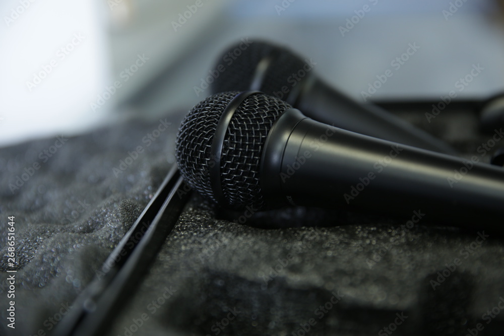 Obraz premium microphone on gray background in soft focus blur