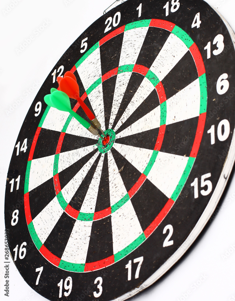side view.Arrow dart hitting the center of the target dart Board side view.Arrow dart hitting the center of the target dart Board