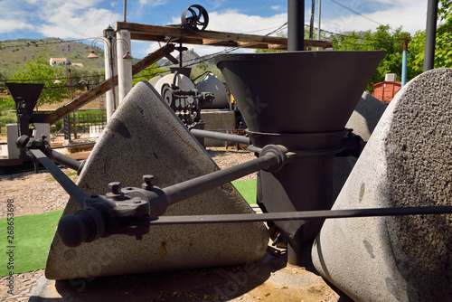 Millstones of Olive press machinery at Nicols Hostel Restaurant near Luque Spain photo