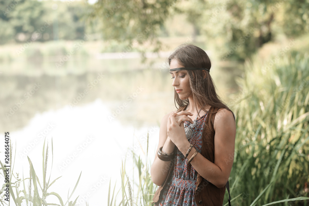 beautiful hippie girl on the background of a forest lake beautiful hippie girl on the background of a forest lake