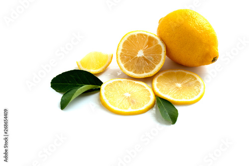 lemon with lime and leaves isolated on white background