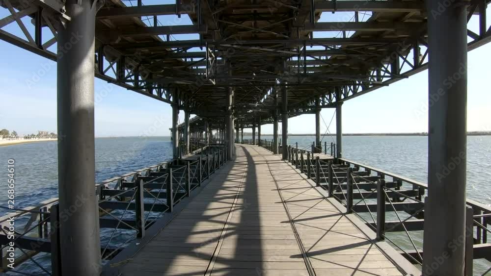 Walking by Mining pier of Riotinto Co., known as the Tinto Dock Walking by Mining pier of Riotinto Co., known as the Tinto Dock