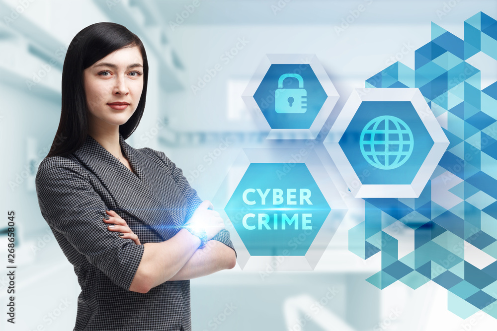 The concept of business, technology, the Internet and the network. A young entrepreneur working on a virtual screen of the future and sees the inscription: Cyber crime The concept of business, technology, the Internet and the network. A young entrepreneur working on a virtual screen of the future and sees the inscription: Cyber crime
