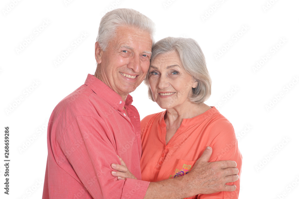 Smiling senior couple wearing bright clothing on white background Smiling senior couple wearing bright clothing on white background