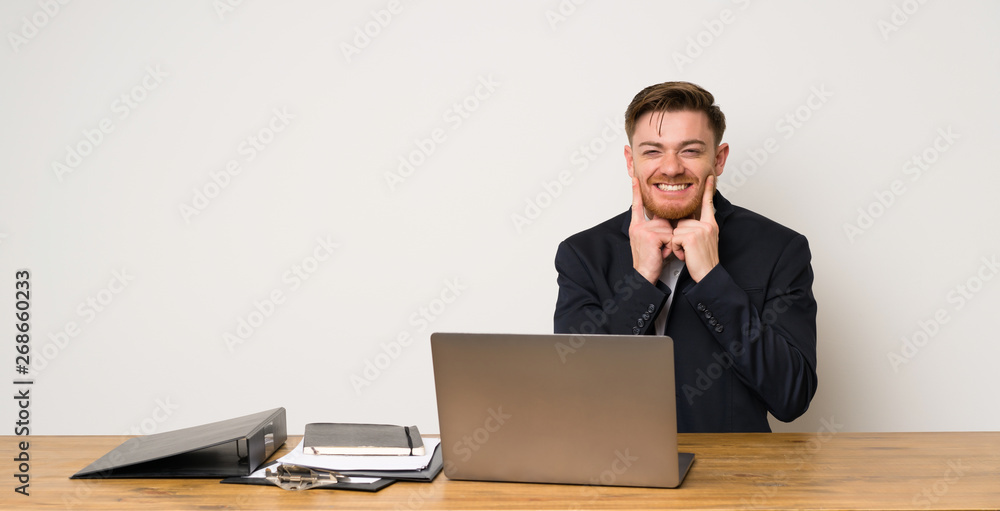 Businessman in a office smiling with a happy and pleasant expression Businessman in a office smiling with a happy and pleasant expression