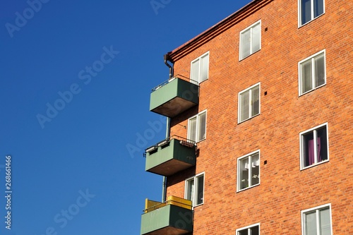 House / apartment building with balconies, blue sky