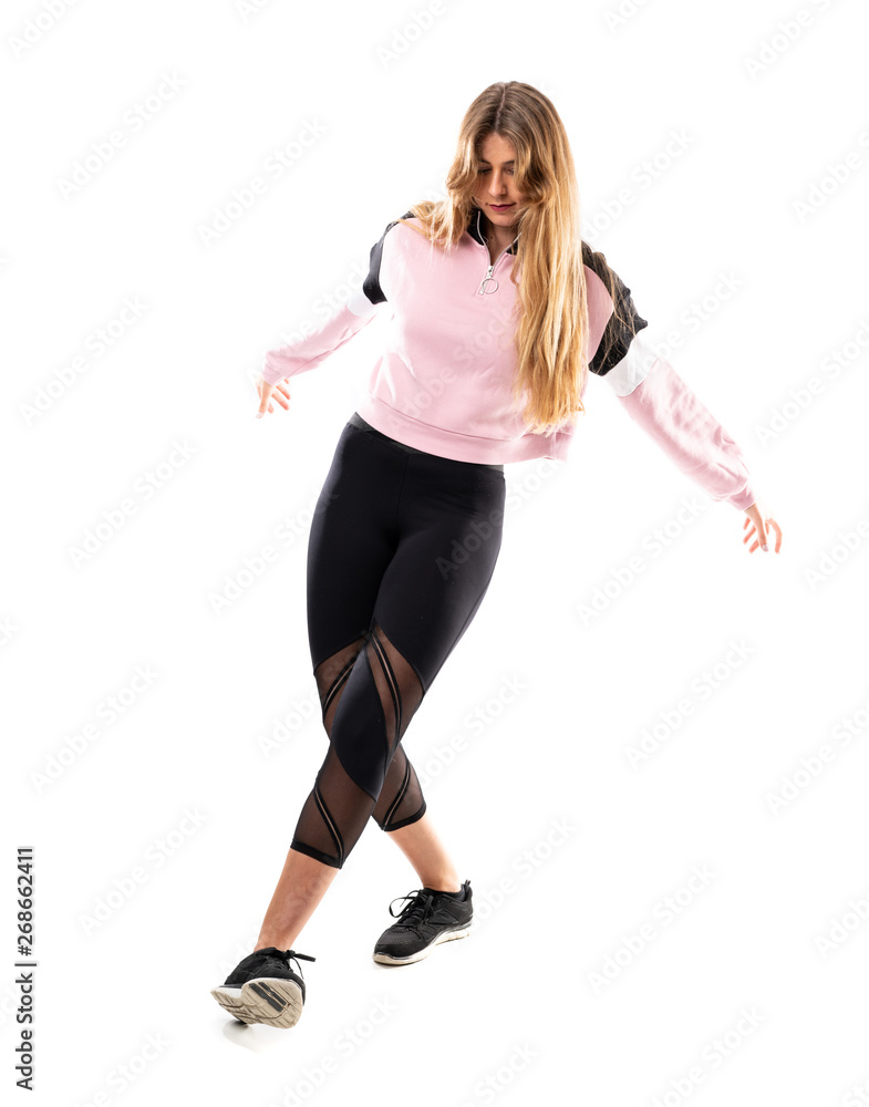 Urban Ballerina dancing over isolated white background Urban Ballerina dancing over isolated white background