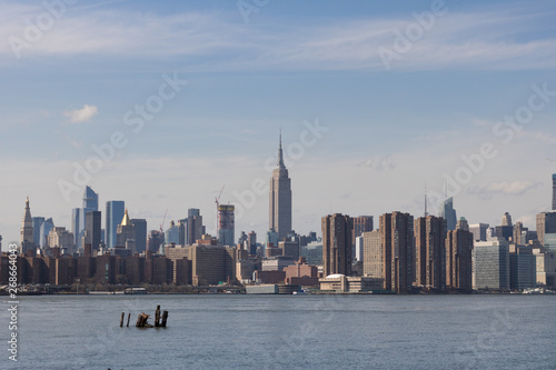 View of Manhattan buildings and river from Brooklyn neighborhood in New York.