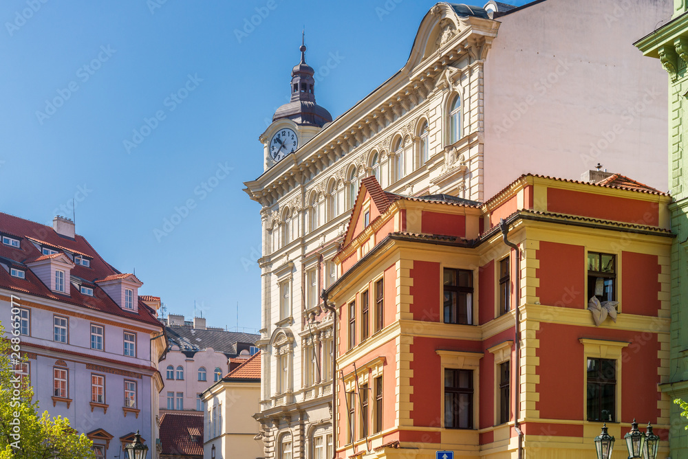 Obraz premium Low angle street sunny view of European Buildings style in old town in Europe. Typical atmosphere of architectural element in Prague, Czech Republic.
