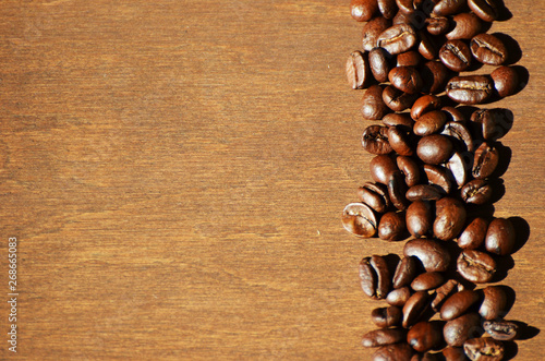 Close-up coffee beans on wooden background, aroma photo © Vita