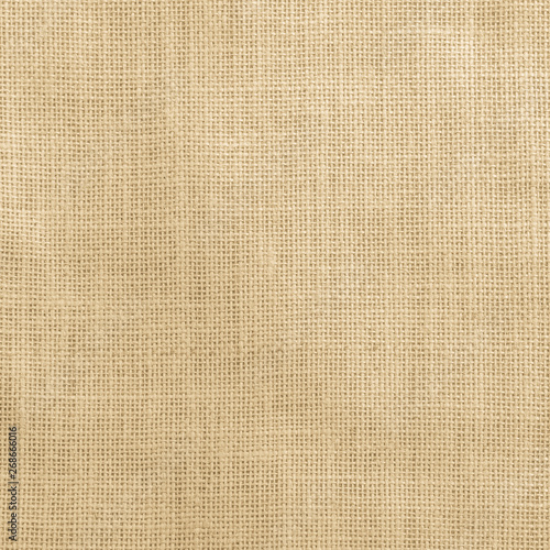 Jute fabric sackcloth burlap texture background yellow cream brown color