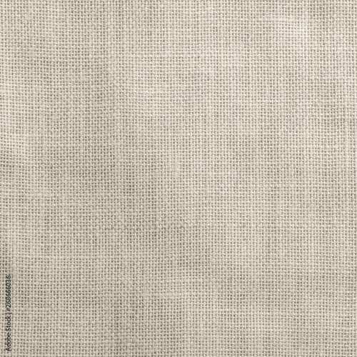 Hessian sackcloth woven texture pattern background in light sepia tan brown color tone