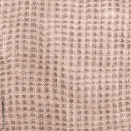 Hessian sackcloth woven texture pattern background in light red cream beige brown color