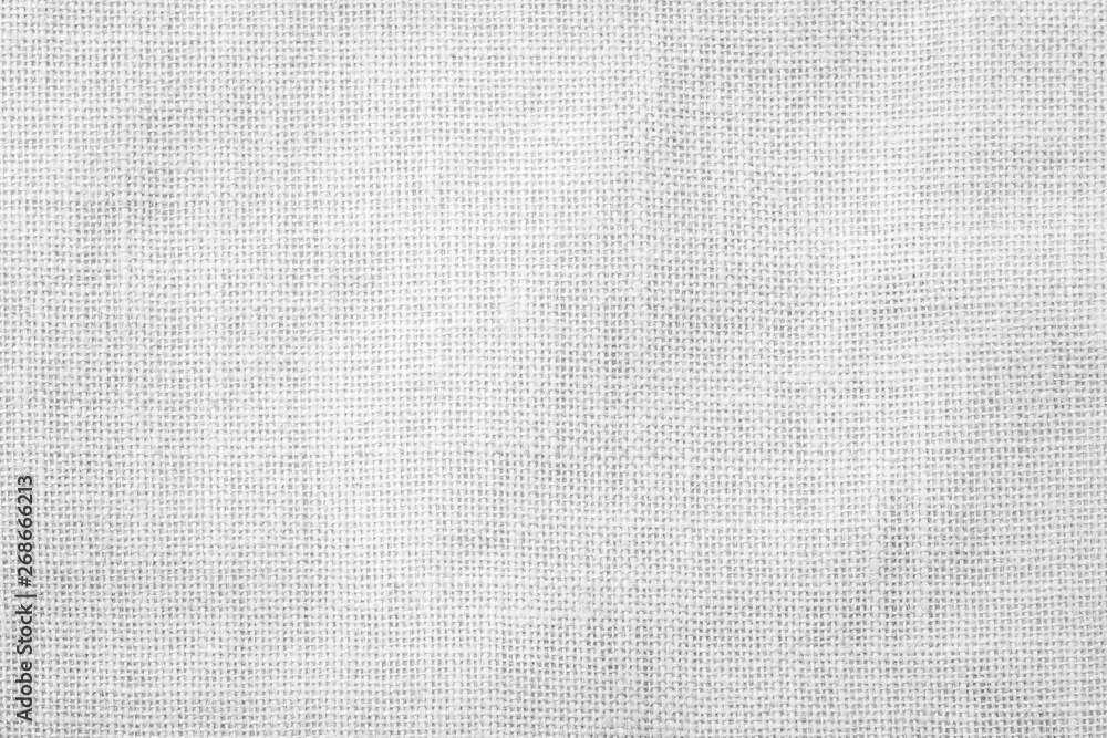 Fototapeta premium Hessian sackcloth woven texture pattern background in light white grey