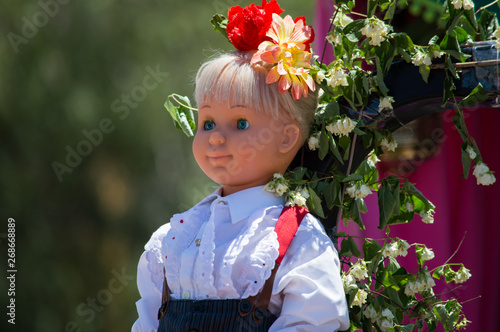 traditional doll with flowers photo