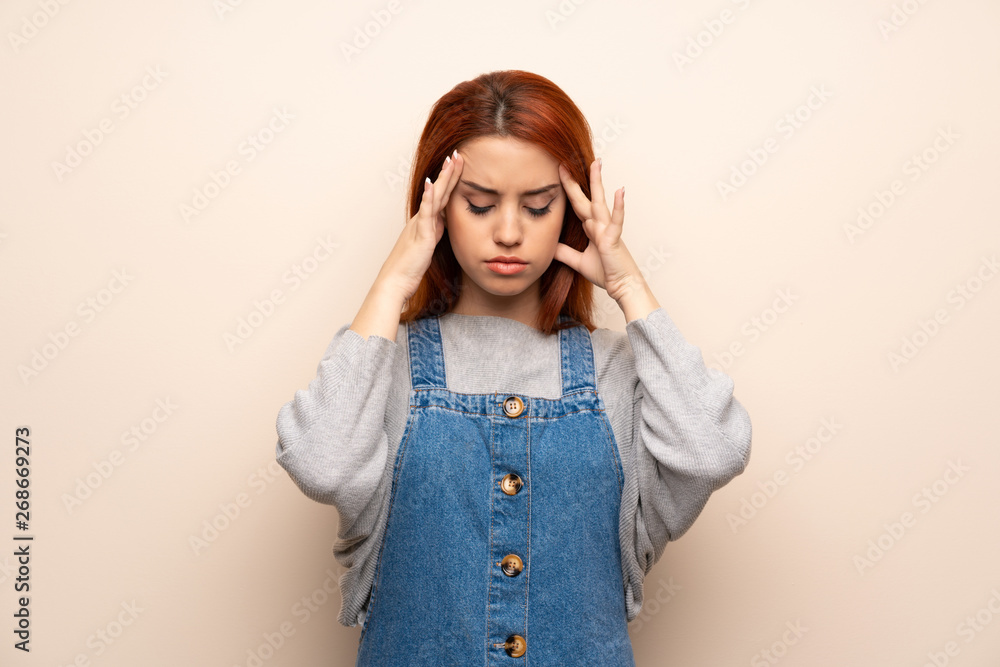 Young redhead woman over isolated background unhappy and frustrated with something Young redhead woman over isolated background unhappy and frustrated with something
