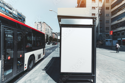 Canvas Print An empty poster mock-up on an outer side of the bus stop; advertising billboard