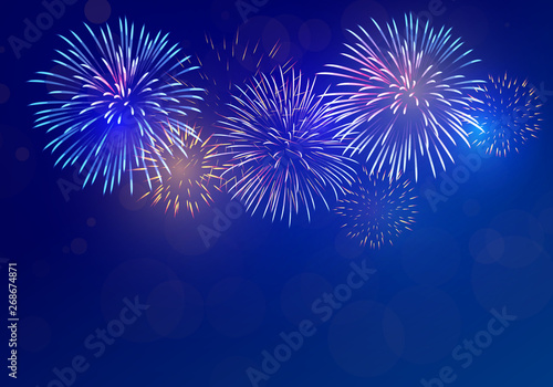 colorful fireworks vector on dark blue background with sparking bokeh photo