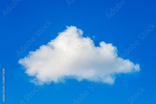 White cloud against a background of blue sky in sunny weather_