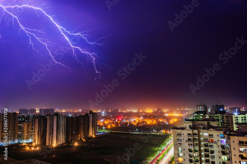 Multiple lighting bolts thunder during a storm with a dramatic sky in noida, delhi India - Image