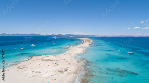 illetas, formentera beach seen from drone with turquoise and crystalline sea and Ibiza in the background photo