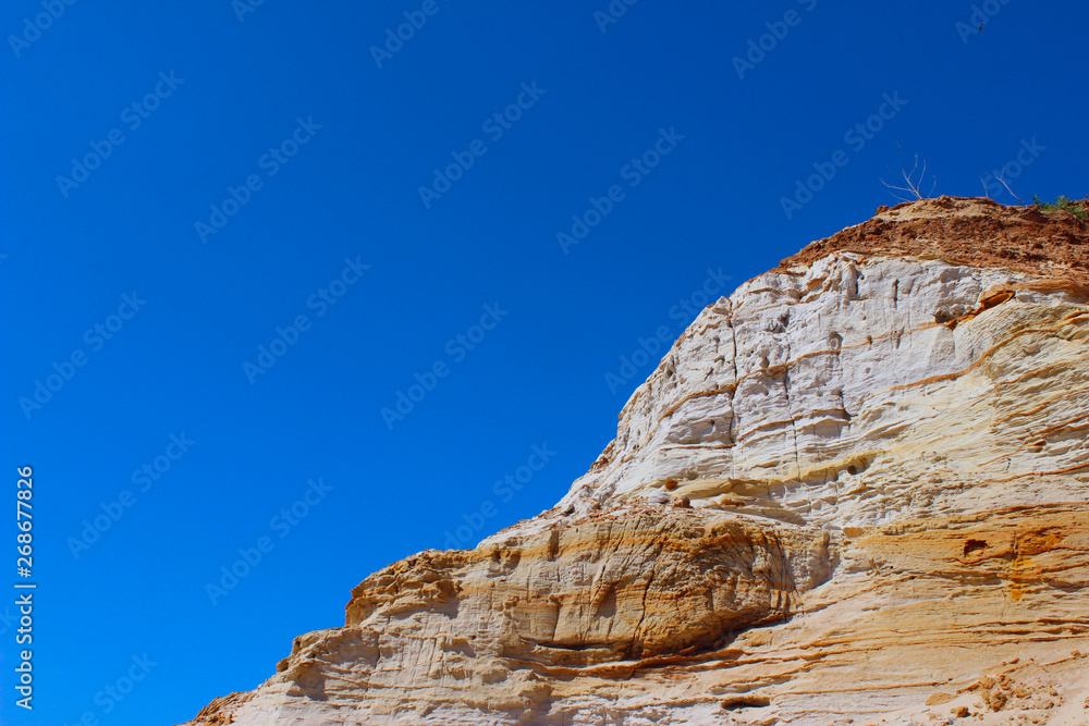 Top Of The Mountain Over Blue Sky Background.  Stone Texture. A Beautiful Mountain Scene.