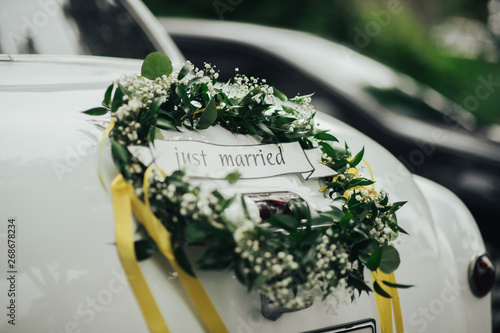 Wedding bouquet on vintage wedding car 