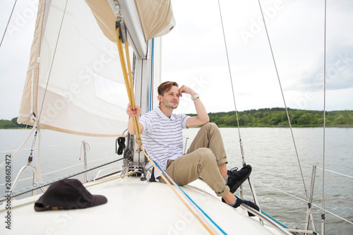Handsome young man on yacht.
