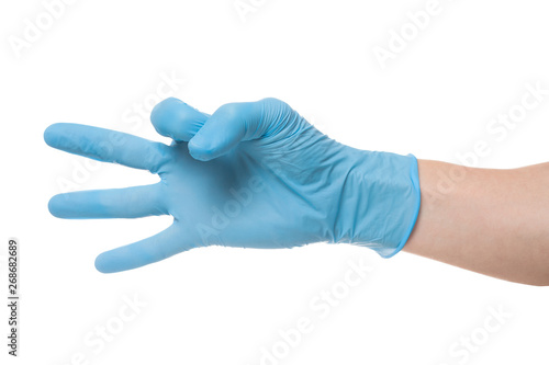 Right hand wearing latex surgical glove with gesture number three on wite background.