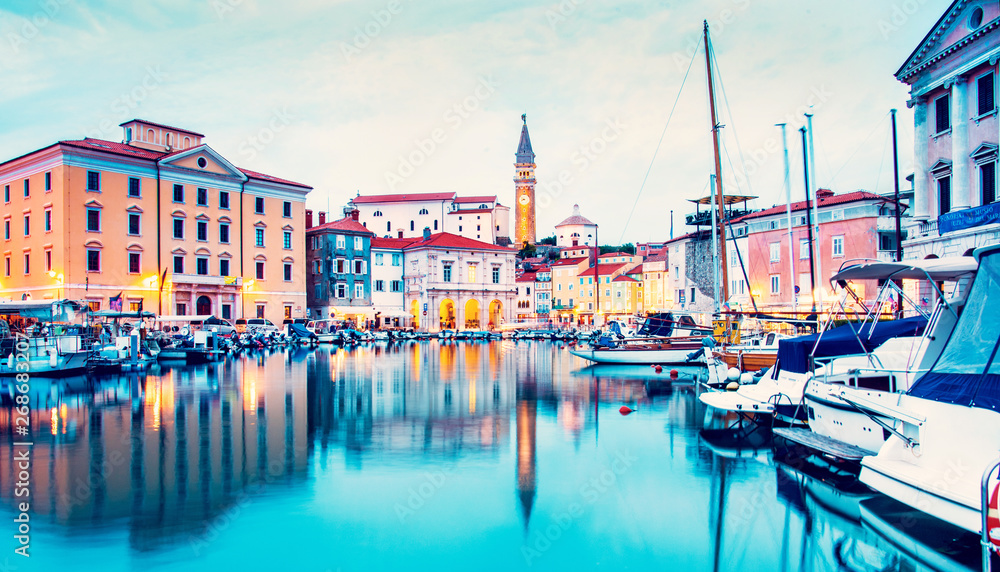 Beautiful amazing city scenery on the waterfront with boats in Piran, the tourist center of Slovenia. popular tourist attraction. Wonderful exciting places.
