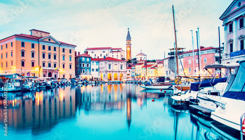 Obraz na płótnie Beautiful amazing city scenery on the waterfront with boats in Piran, the tourist center of Slovenia. popular tourist attraction. Wonderful exciting places. w salonie