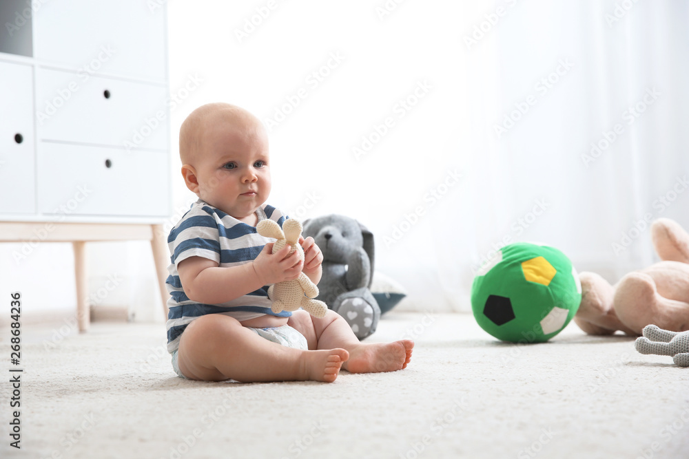 Cute little baby on carpet indoors. Crawling time Cute little baby on carpet indoors. Crawling time