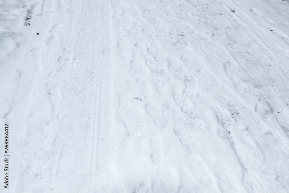 Foot prints of human shoes on the white snow Foot prints of human shoes on the white snow