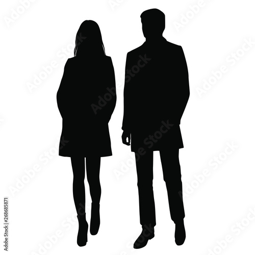 Vector silhouettes of  man and a woman, a couple of standing business people, black color isolated on white background