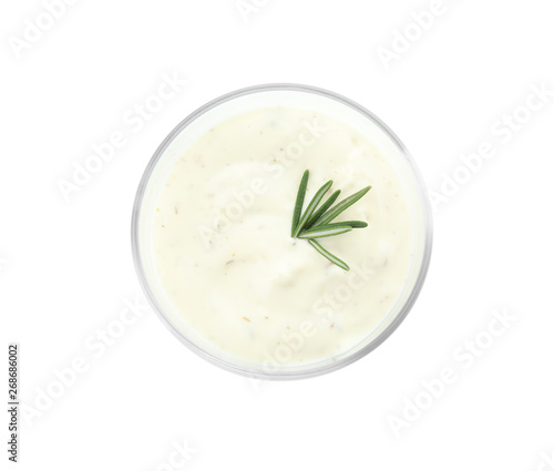 Glass bowl of garlic sauce on white background, top view