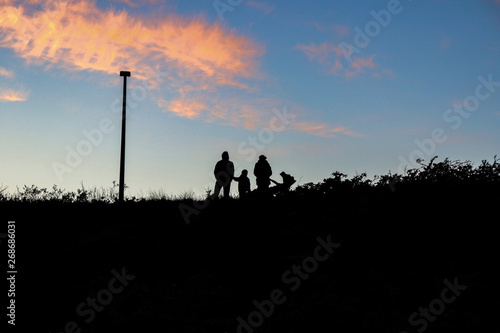 Family with young child watching the sky